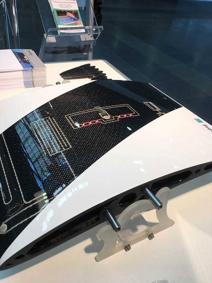 Smart aircraft wing from Fraunhofer IFAM using a functionally integrated fiber reinforced plastic (FRP), with printed sensors, heating structure, UHF antenna and LEDs all integrated into the fabric layer of the composite structure. Marie O’Mahony