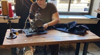 The Raleigh Denim Workshop offering bespoke locally made denim jeans with machinist altering the length to fit while the customer waits. Photo courtesy Marie O’Mahony