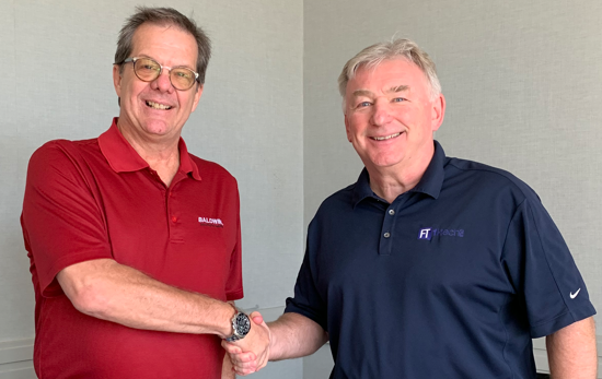 Baldwin's Rick Stanford and Fi-Tech's Ian Mills kick off partnership with a handshake.