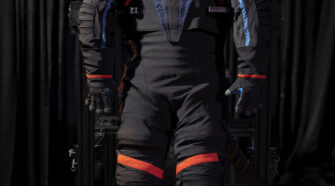 The Artemis III spacesuit prototype, the AxEMU. Though this prototype uses a dark gray cover material, the final version will likely be all-white when worn by NASA astronauts on the Moon’s surface. Photo courtesy Axiom Space