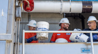 The team collects samples from wastewater stream.