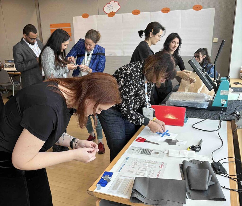 Participants at the inaugural Design@LOPEC workshop in 2025 undertaking activities that included trend forecasting as well as hands-on functional e-textile sample making.