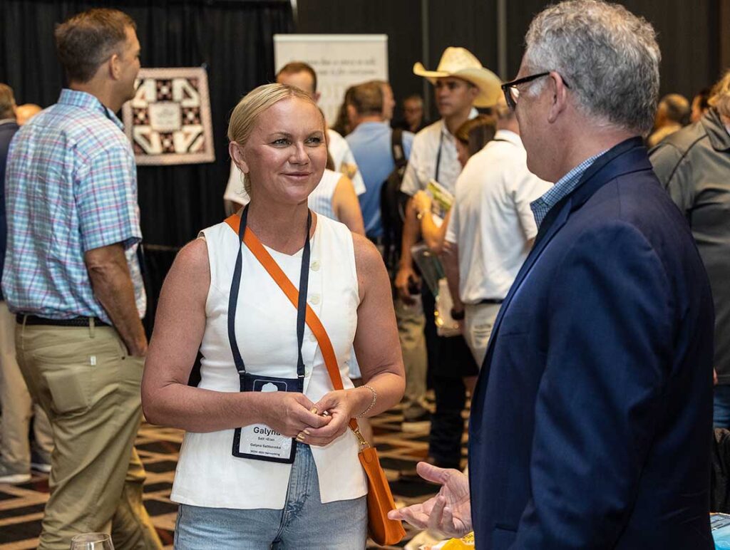 Galyna Saltkovska (left), Salt+Elan; and Michael Lynch, IMA North America, chatting during a reception.