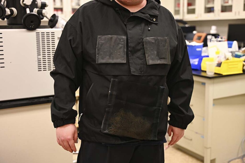 A researcher wearing the water-harvesting jacket. Photo courtesy of The University of Texas at Austin